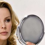 Woman looking in the mirror